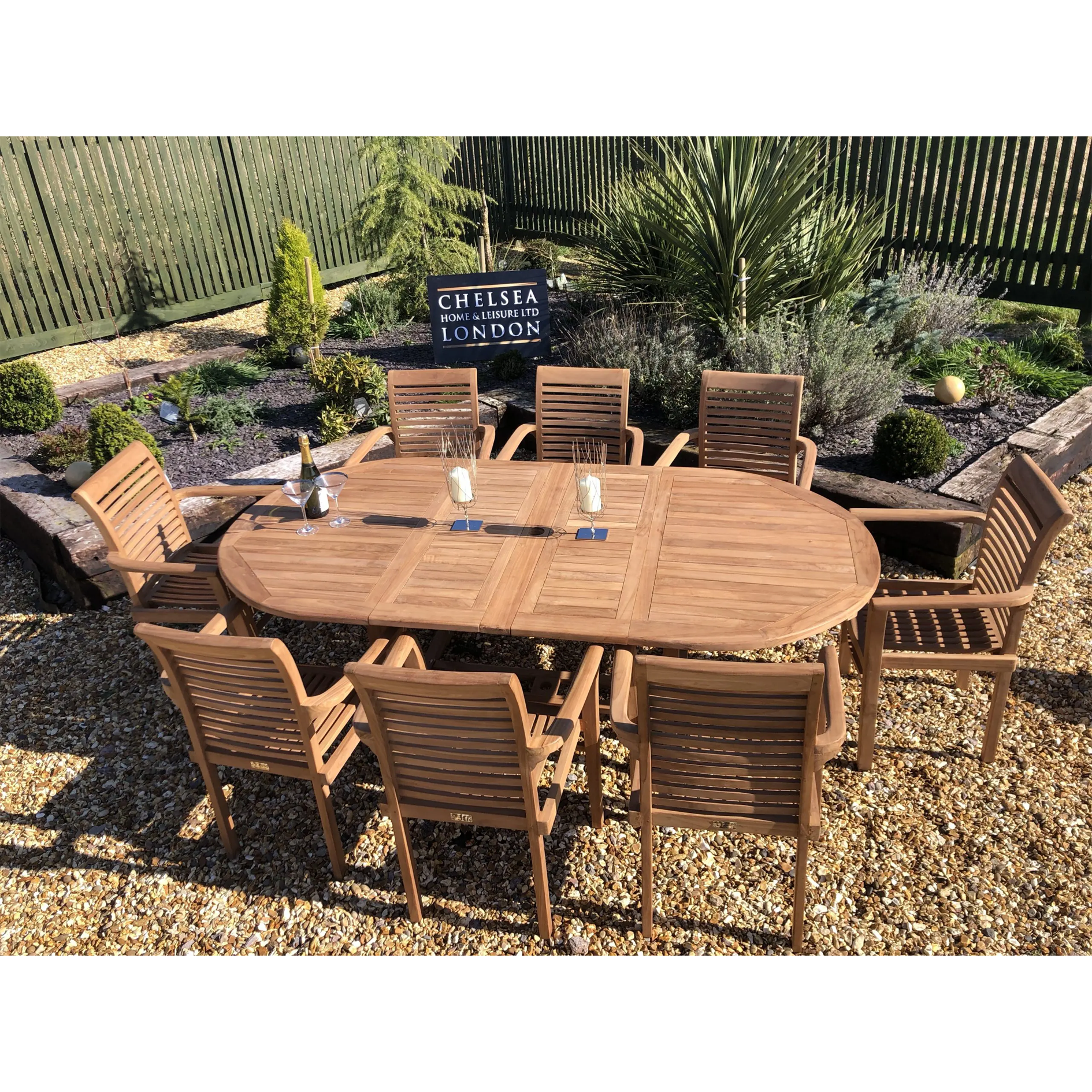 Teak extending table with 8 stacking chairs