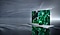 An OLED TV is displaying a green graphic on its screen while floating on top of a gray surface.