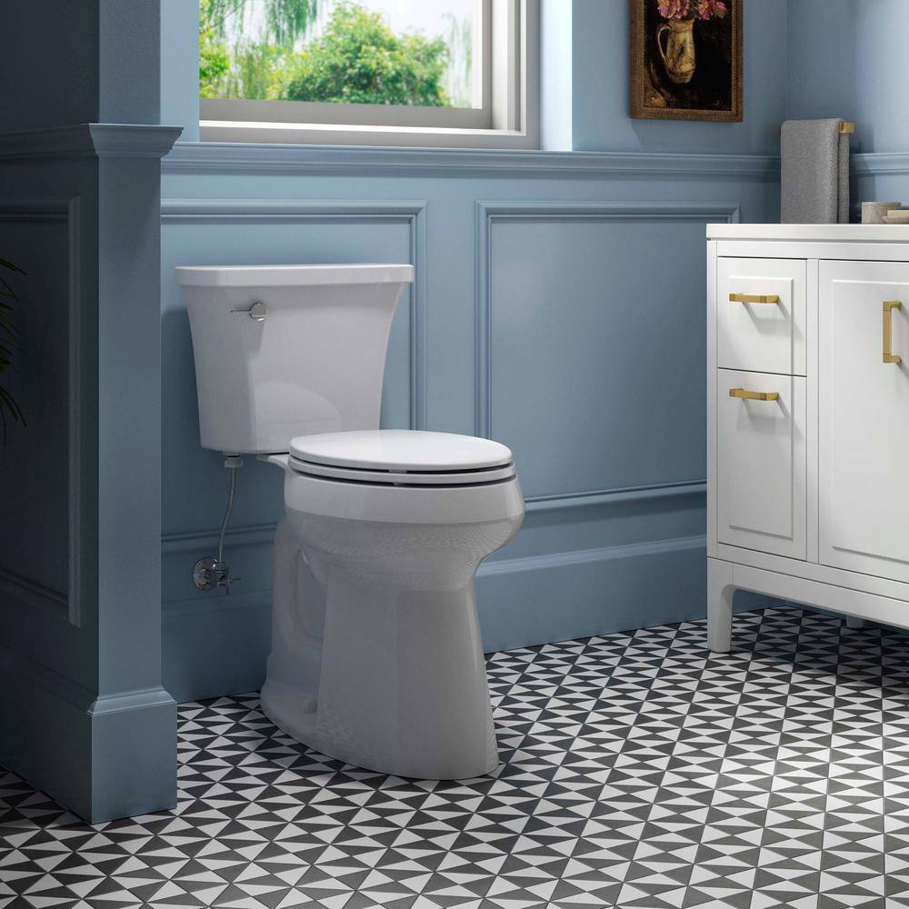 KOHLER Extra hohes Highline Arc Zweiteiliges WC mit Einzelspülung (1,28 GPF). Verlängerte Form. Weiß (inkl. WC-Sitz).